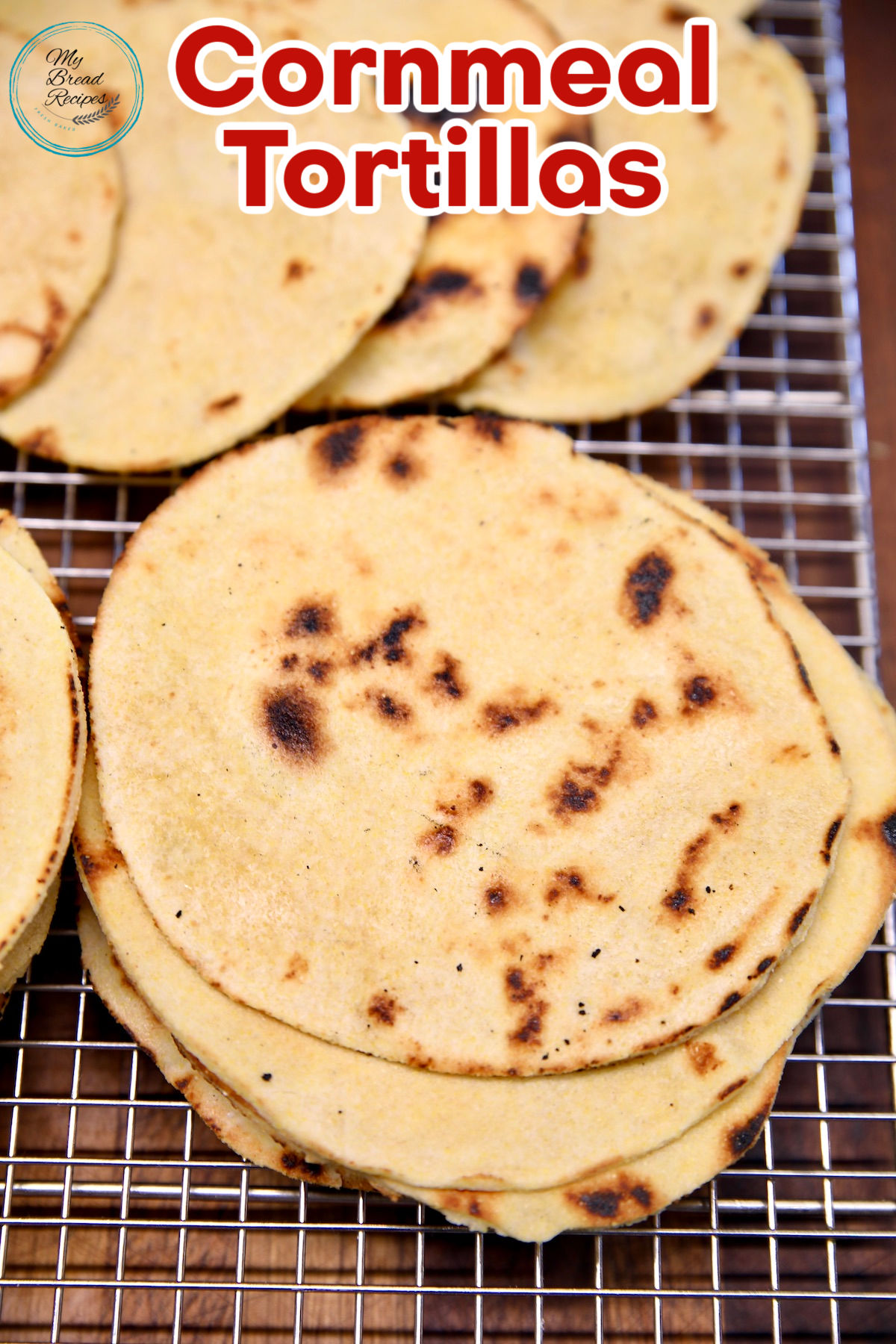 Cornmeal tortillas on a wire rack, text overlay.