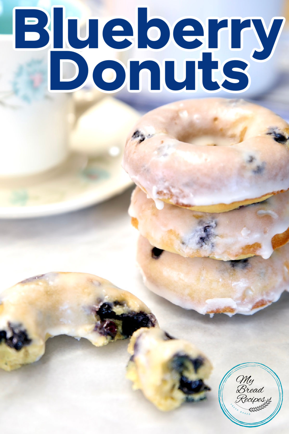 Stack of blueberry donuts, one in half, text overlay.