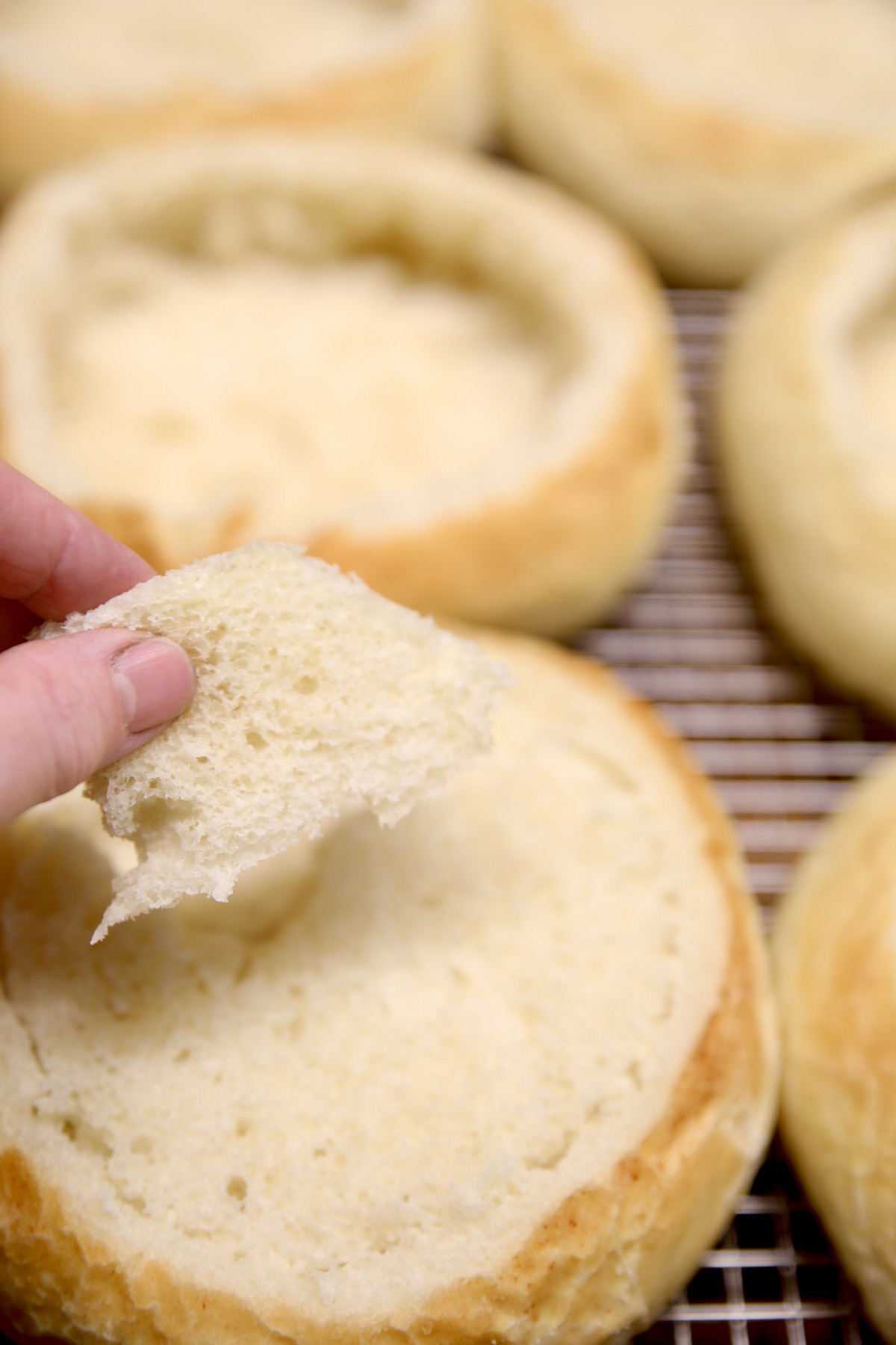 Removing inside of bread bowl for soup.