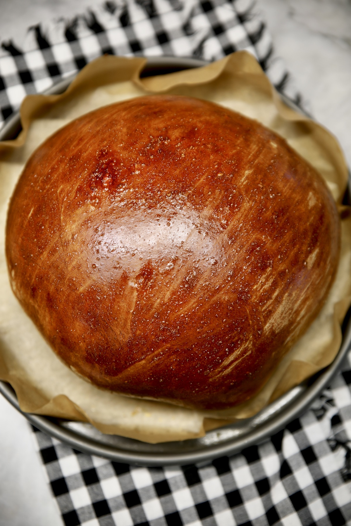 Baked Hawaiian round bread on a pan. 