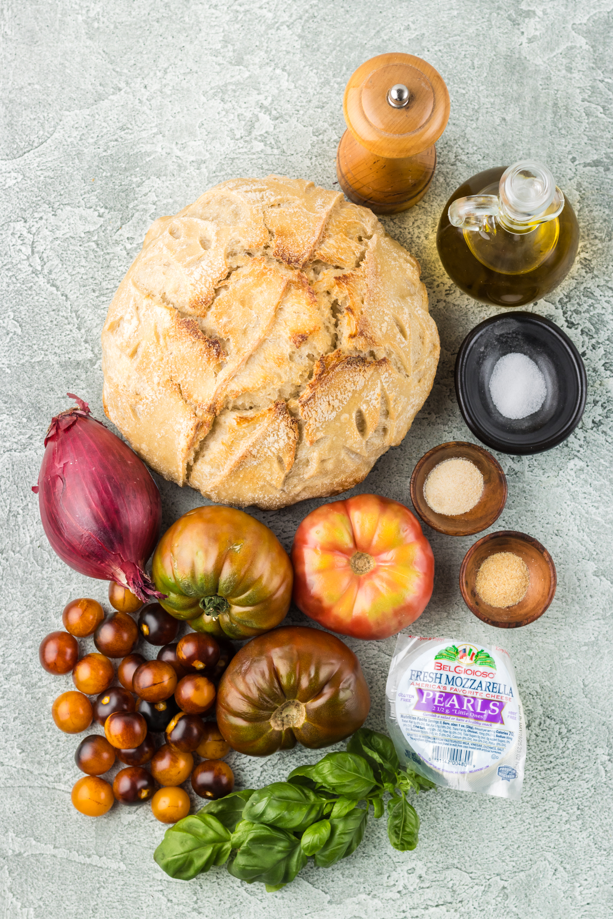 Fresh salad ingredients. Bread, olive oil, spices, tomatoes and onion