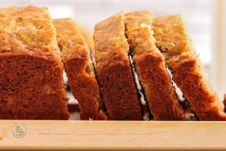 Sliced banana bread on a cutting board.