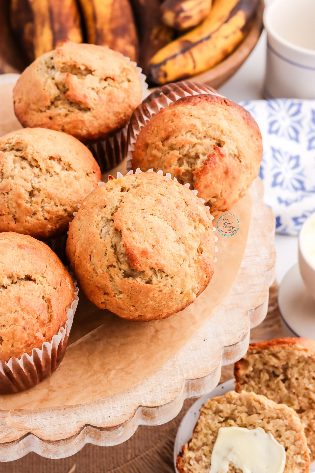 banana bread muffins lined on wood plate
