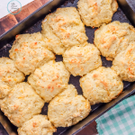 Garlic cheddar biscuits on a baking sheet