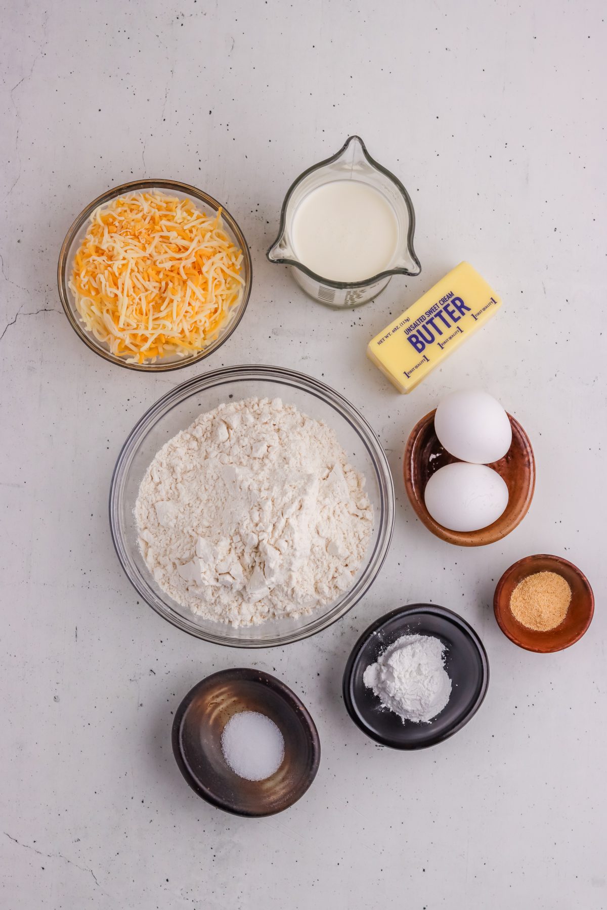 garlic cheese drop biscuits ingredients in individual bowls garlic cheese drop biscuits ingredients in individual bowls