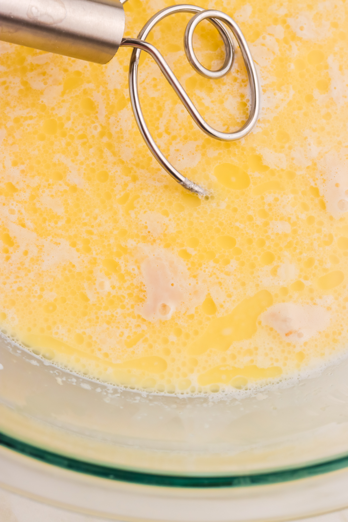Milk and yeast activating in a bowl.