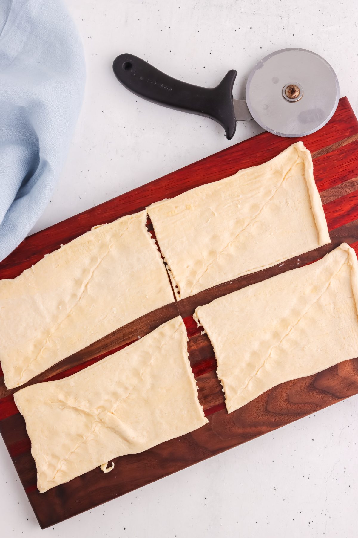 crescent dough rolled out. crescent dough rolled on a wood board.